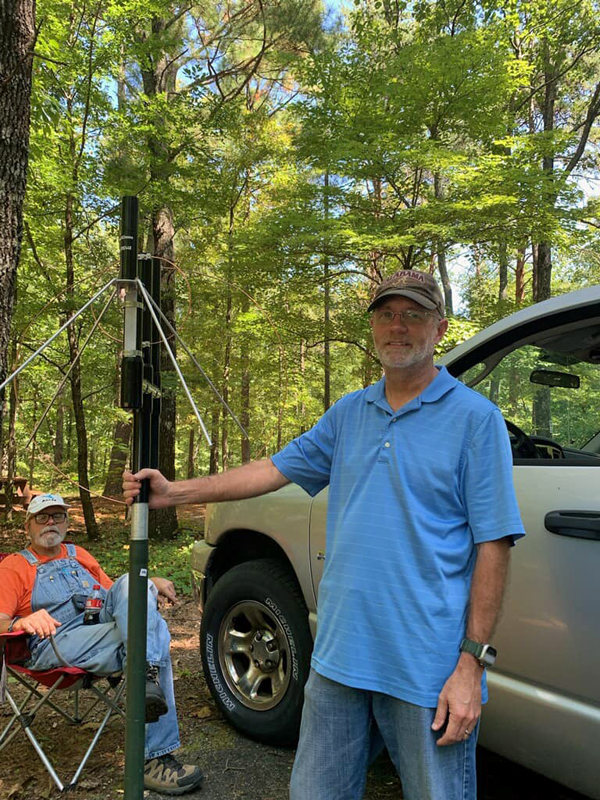 John (KQ4ESQ) proudly displaying his new directional antenna while Bob (KE4QCY} looks on.  The antenna is a directional microbeam by COMPACtenna for use on 2m & 440MHz.
