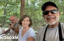 Clara KO4OQB and Billy KG4DXM help Nick KQ4GIO make contacts.